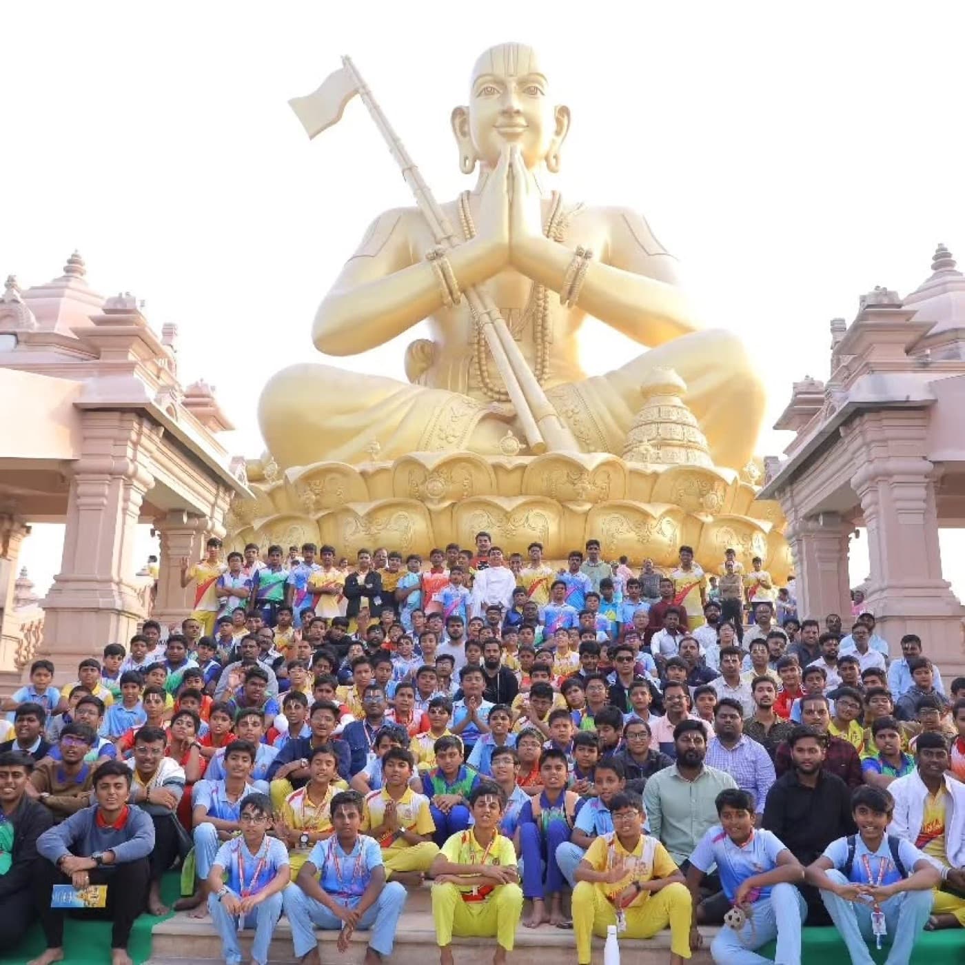 The golden 216-foot murti of Bhagavad Sri Ra:ma:nuja:cha:rya in a seated Anjali pose